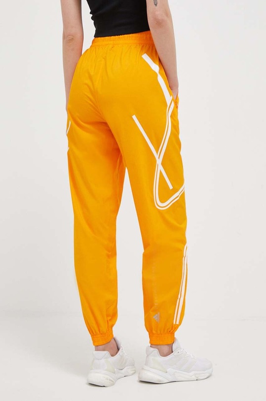 Одежда Тренировочные брюки adidas by Stella McCartney TruePace IC6017 оранжевый