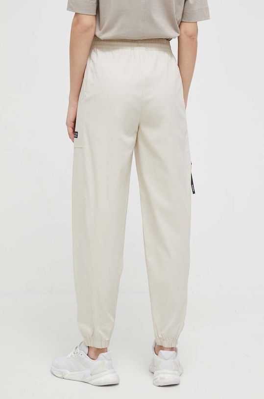 Îmbrăcăminte New Balance pantaloni WP31506TWF bej