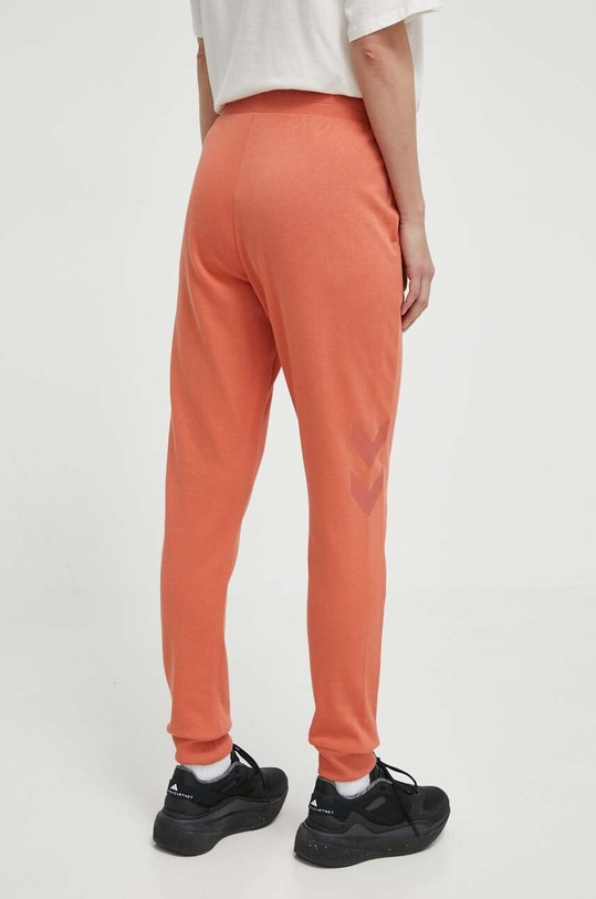 Odzież Hummel spodnie dresowe hmlLEGACY WOMAN TAPERED PANTS 212564 pomarańczowy