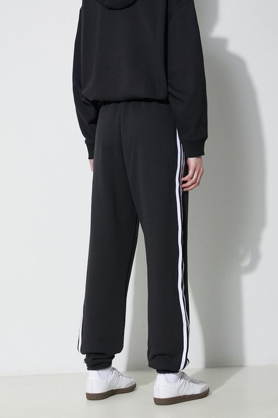 Одяг Бавовняні спортивні штани adidas Originals IB7457 чорний