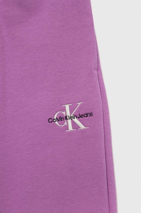Dziewczynka Calvin Klein Jeans spodnie dresowe dziecięce IG0IG01854.PPYX fioletowy