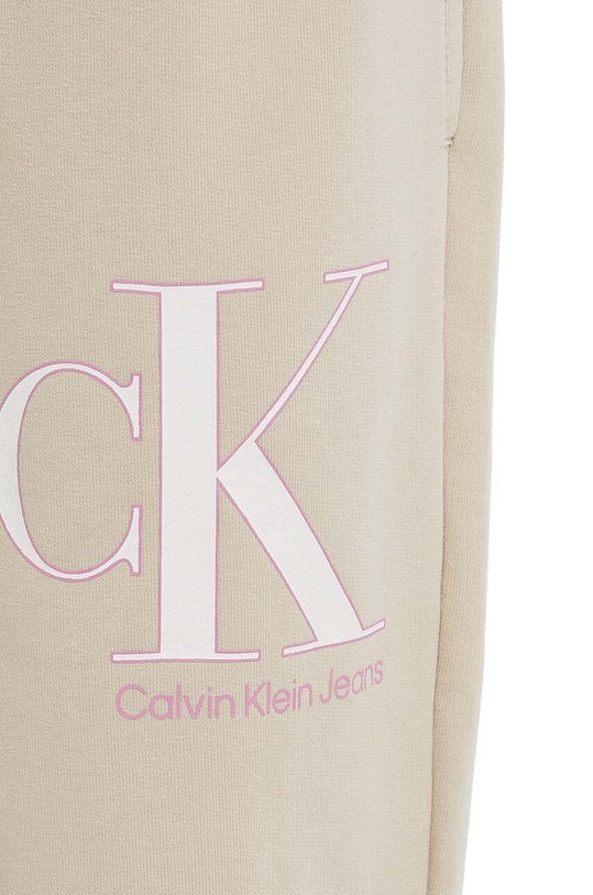 Dětské tepláky Calvin Klein Jeans béžová IG0IG01985.PPYX