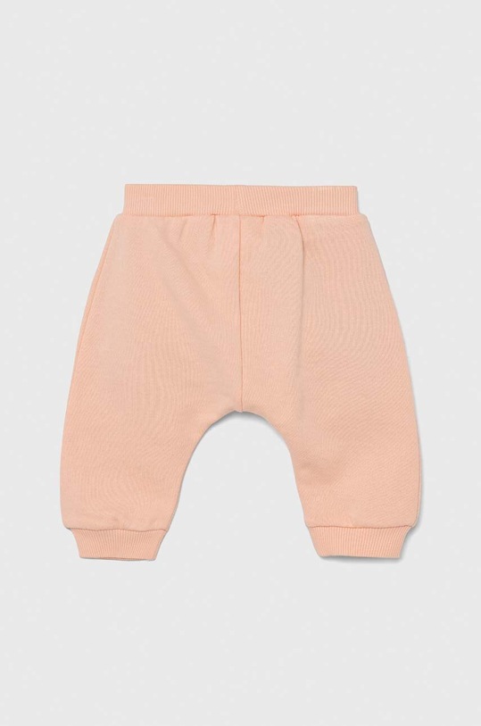 United Colors of Benetton spodnie dresowe bawełniane niemowlęce x Looney Tunes 3J68AF012.W.SEASONAL pomarańczowy SS23