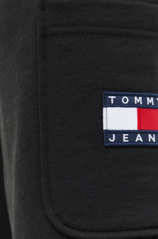 Bavlněné tepláky Tommy Jeans černá DM0DM15849.PPYX