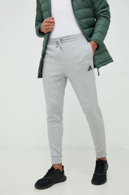 Donji dio trenirke adidas bez uzorka siva HL2230