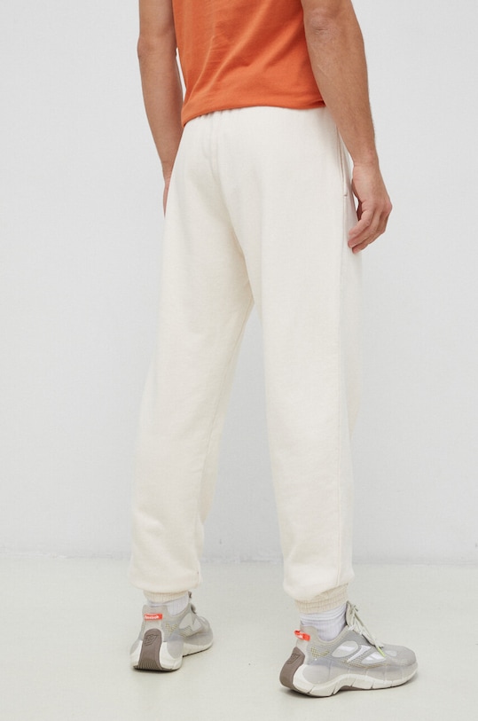 Odzież Reebok Classic spodnie dresowe bawełniane HS9153 beżowy