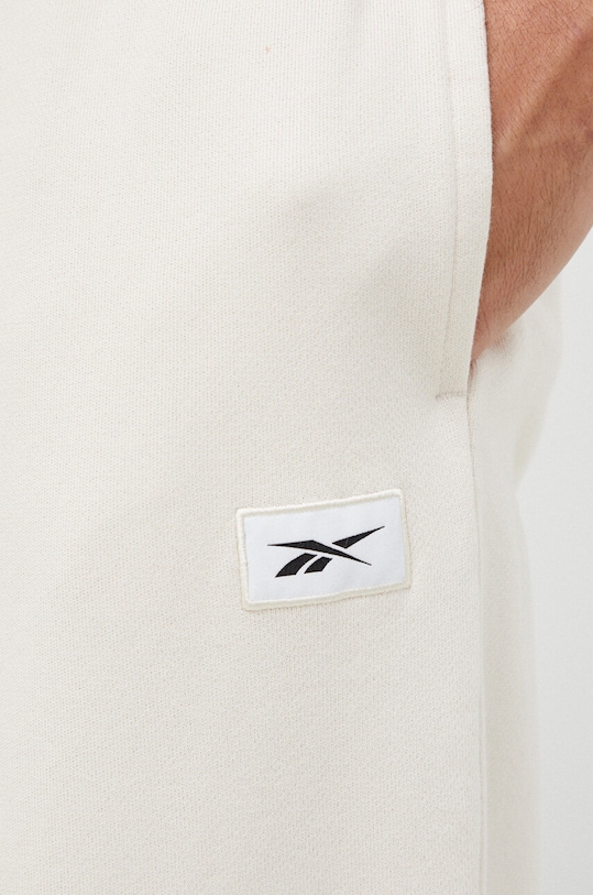 Reebok Classic spodnie dresowe bawełniane beżowy HS9153