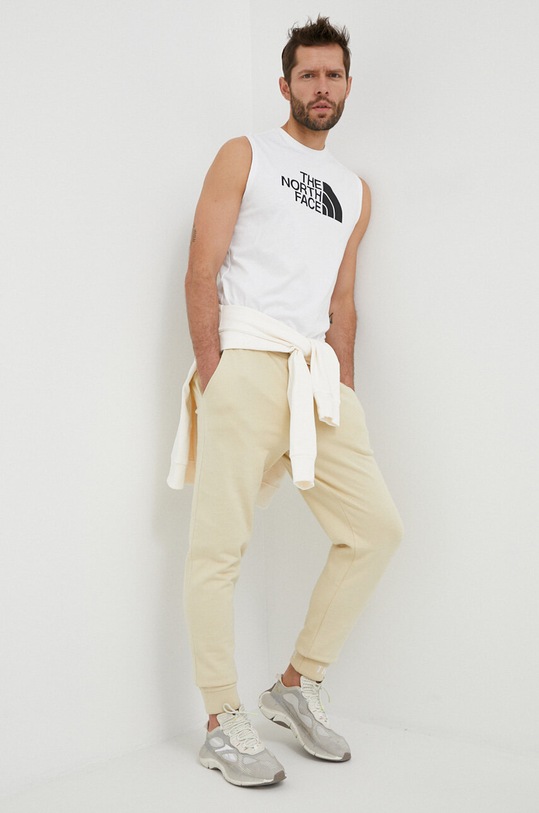 The North Face spodnie dresowe bawełniane NF0A5ILI3X41 beżowy SS23
