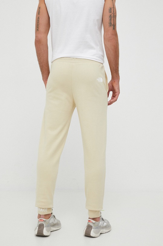 Odzież The North Face spodnie dresowe bawełniane NF0A5ILI3X41 beżowy