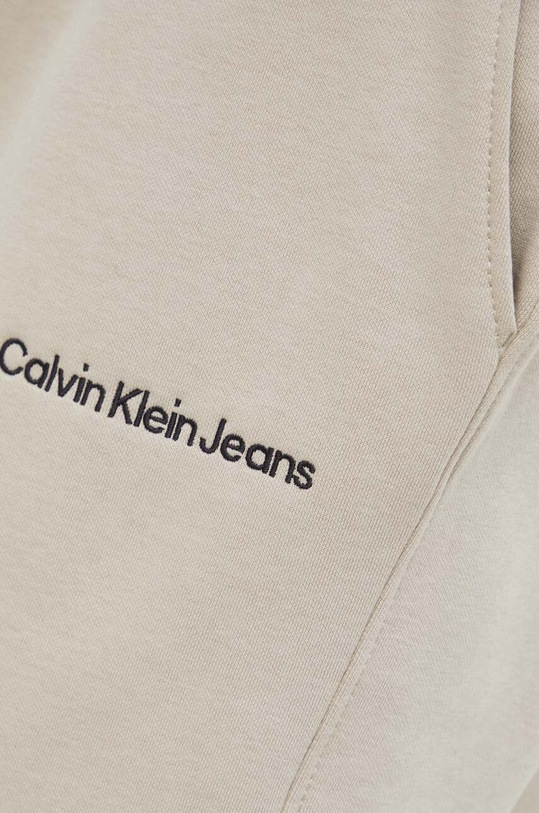 Calvin Klein Jeans spodnie dresowe beżowy J30J322925.PPYX