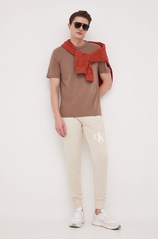 Calvin Klein Jeans spodnie dresowe J30J322917.PPYX beżowy SS23
