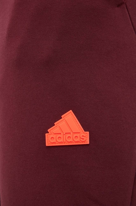 Tepláky adidas burgundské IC8035