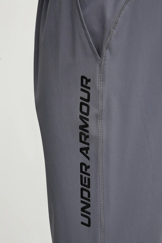 Bežecké nohavice Under Armour Storm sivá 1376800