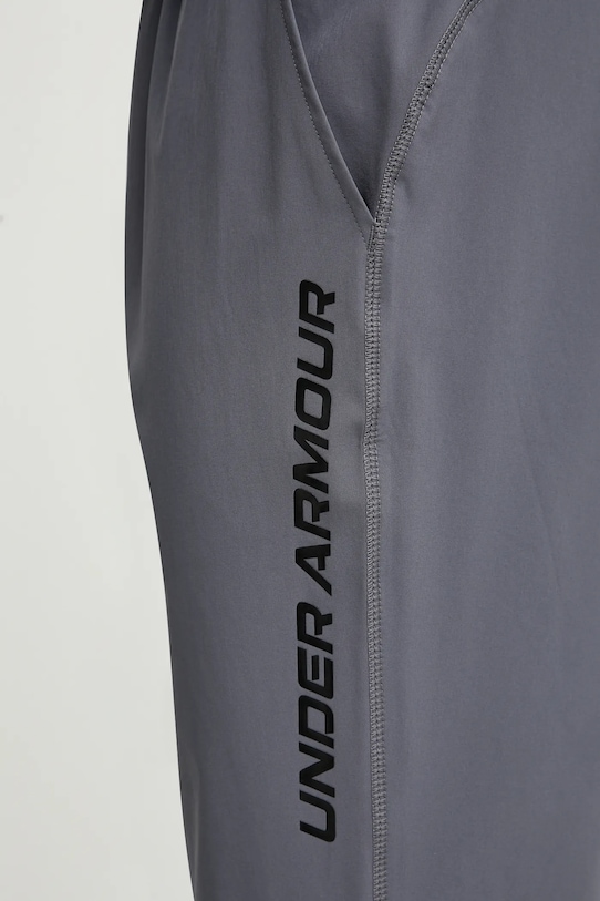 Běžecké kalhoty Under Armour Storm šedá 1376800