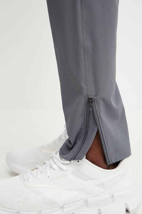 Bežecké nohavice Under Armour Storm 1376800 sivá