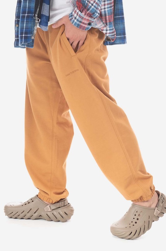 New Balance spodnie dresowe bawełniane MP23551TOB