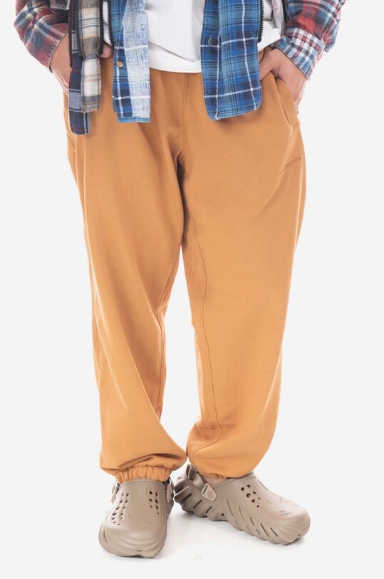 New Balance spodnie dresowe bawełniane MP23551TOB