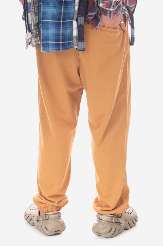 New Balance spodnie dresowe bawełniane MP23551TOB