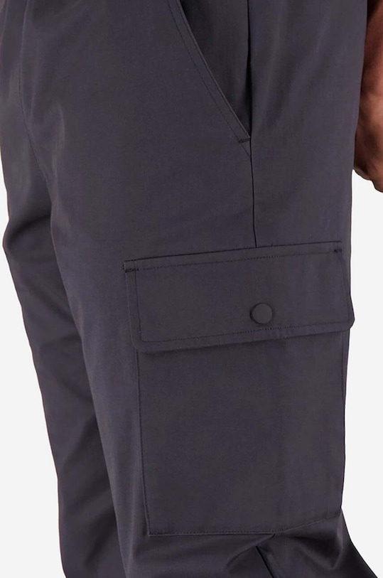 New Balance spodnie MP31526BK szary