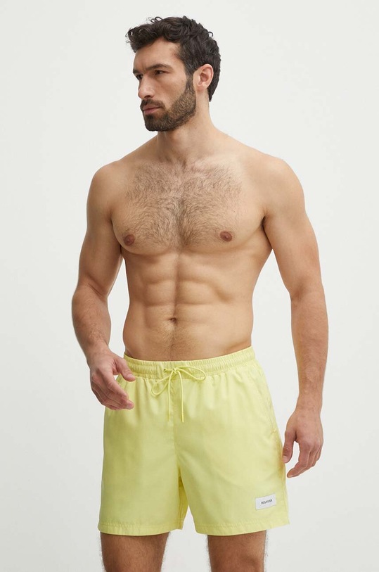 Plavkové šortky Tommy Hilfiger Planet friendly žlutá UM0UM03215