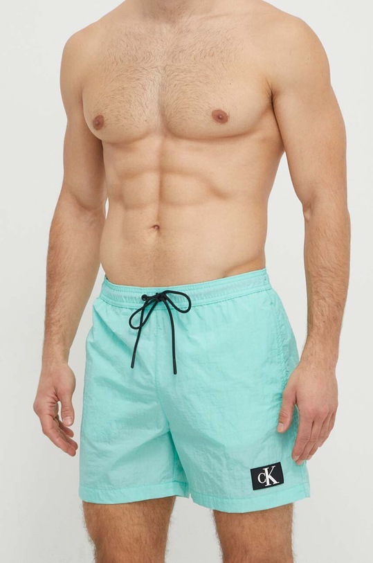 Plavkové šortky Calvin Klein KM0KM00980 zelená SS24
