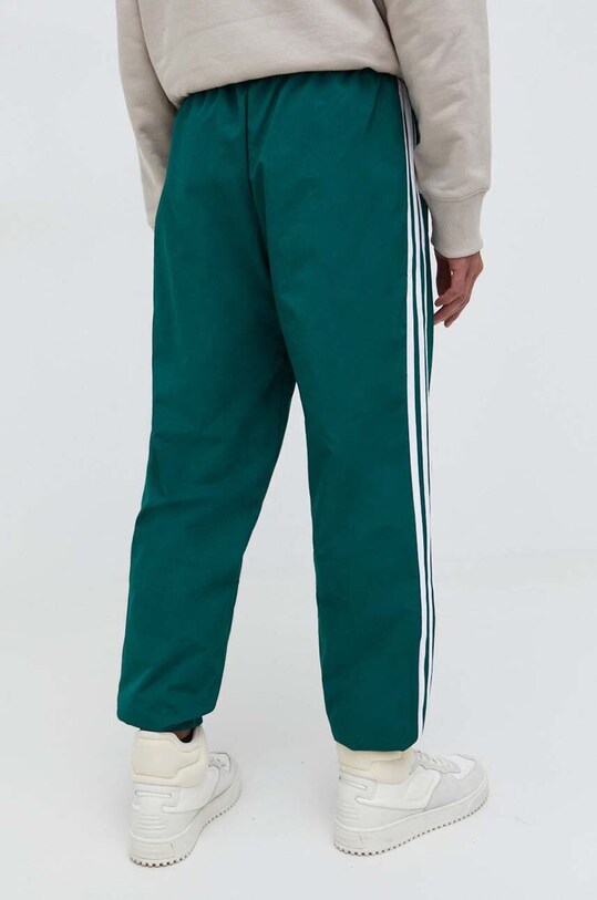 Одежда Спортивные штаны adidas Originals Adicolor Woven Firebird Track Top IT2497 бирюзовый