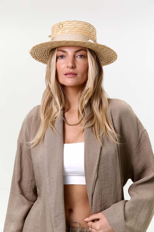 Pălărie din colecția LE SH KA headwear. Model cu bor larg, confecționat din paie naturale. lana bej GoldCanotier