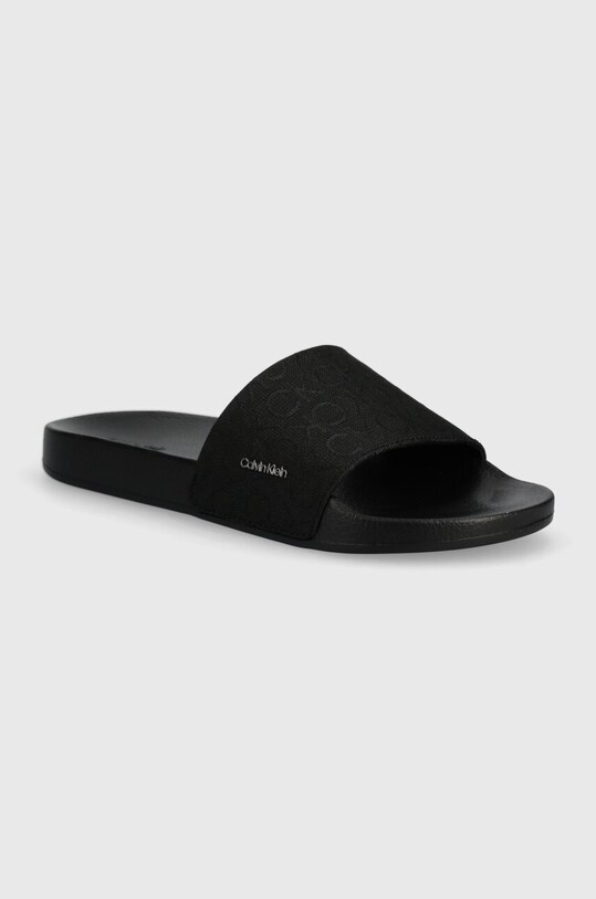 Calvin Klein klapki POOL SLIDE WCALVIN MET MONOCQ tekstylny czarny HW0HW01971