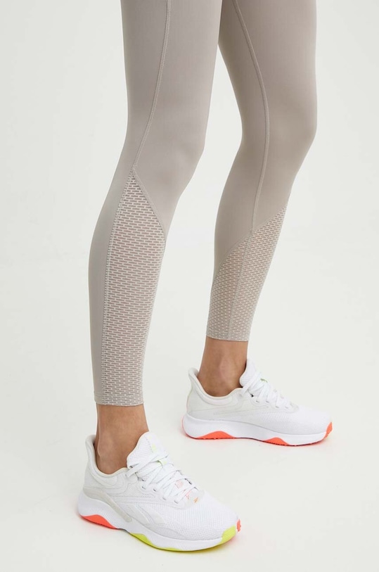 Reebok legginsy do biegania beżowy 100076060