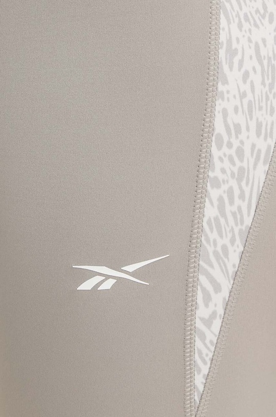 Reebok legginsy do biegania 100076060 beżowy