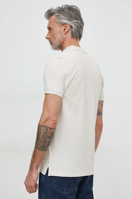 Tommy Jeans polo bawełniane DM0DM18312 beżowy AW24