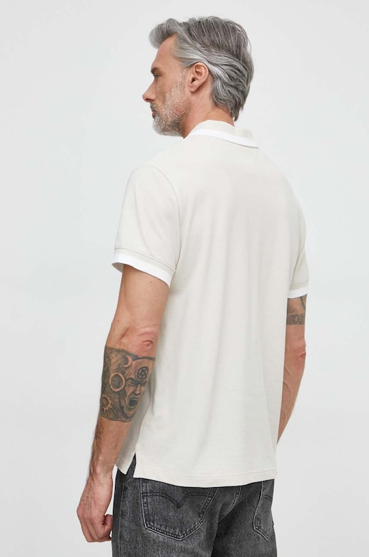 Tommy Jeans polo bawełniane DM0DM18313 beżowy SS24