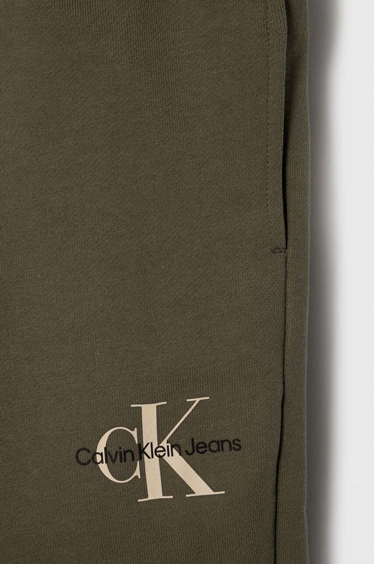 CHLAPEC Dětské bavlněné tepláky Calvin Klein Jeans IU0IU00285.128.176.PPYH zelená