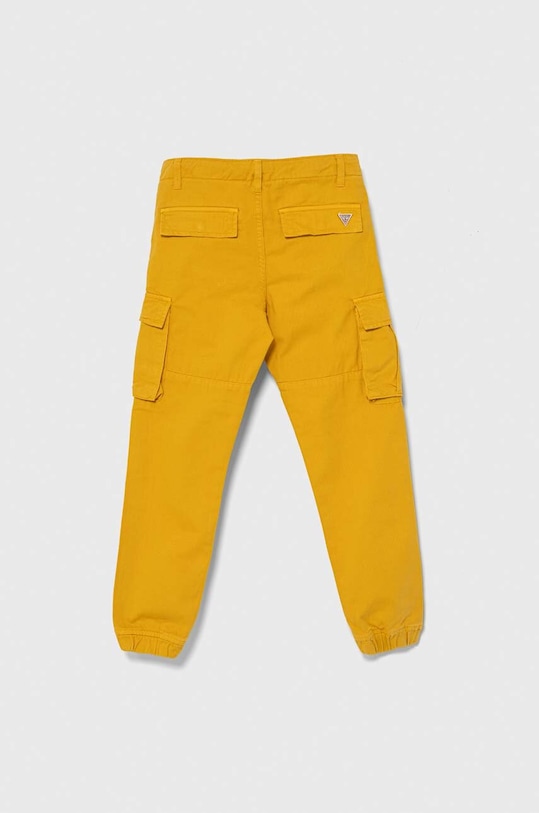 Guess spodnie bawełniane dziecięce N3YB04.WE1L0.PPYH żółty SS24
