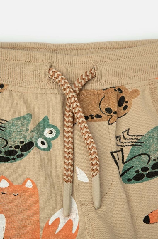 Coccodrillo spodnie dresowe niemowlęce beżowy WC4122101NAN