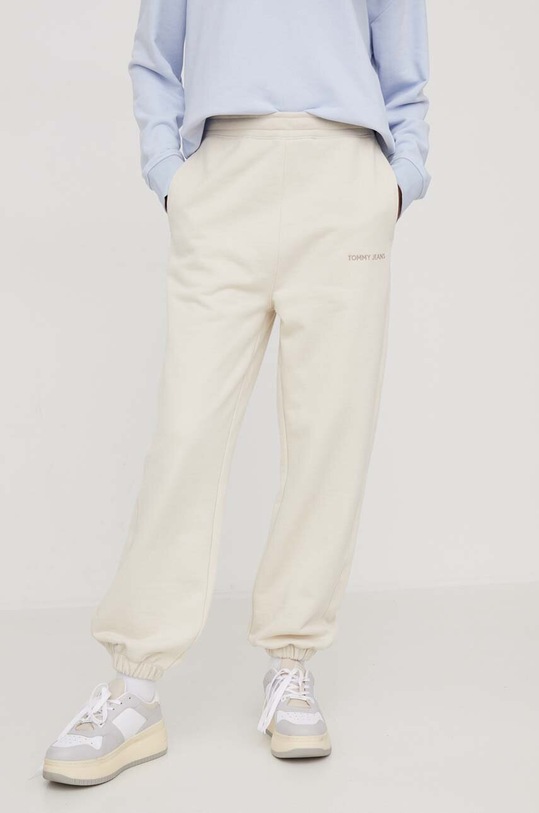 Tommy Jeans spodnie dresowe bawełniane DW0DW17309 beżowy AW24