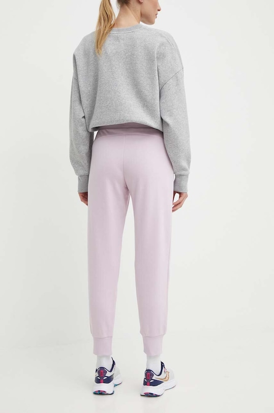 Odzież Puma spodnie dresowe 586843 różowy