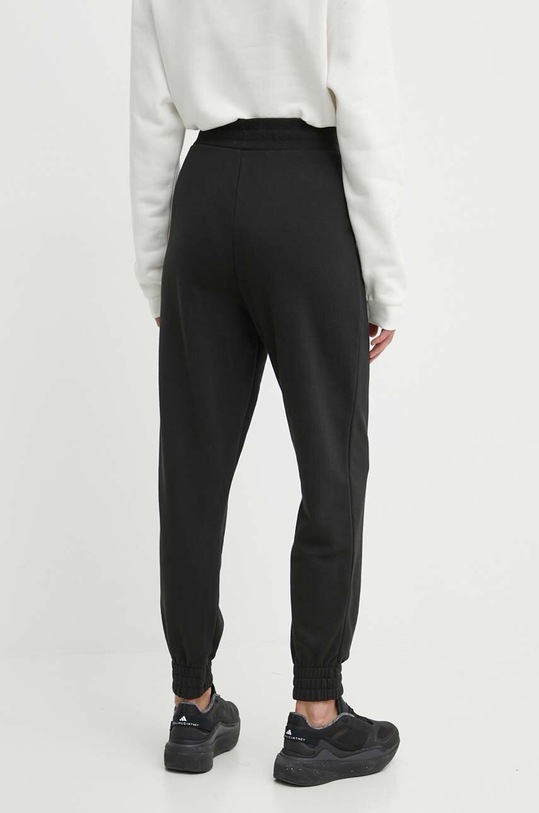 Odzież Puma spodnie dresowe 847093 czarny