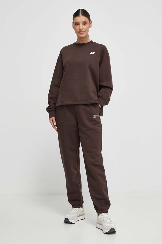 New Balance spodnie dresowe WP33513KCF WP33513KCF brązowy SS24