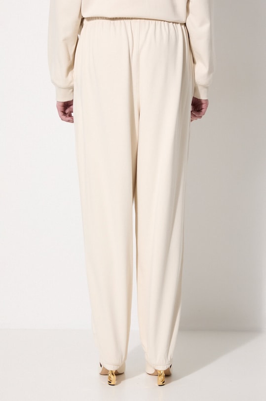 Ρούχα Βαμβακερό παντελόνι New Balance WP41513LIN μπεζ