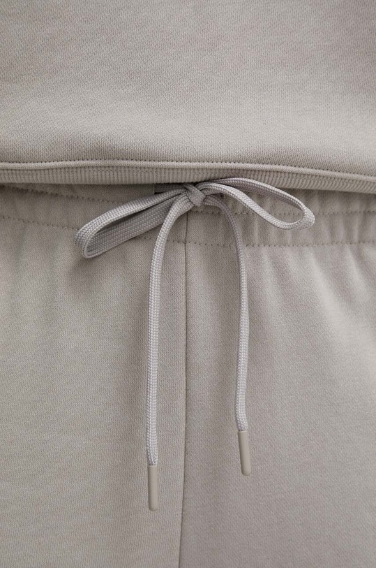 Under Armour spodnie dresowe Project Rock beżowy 1383305