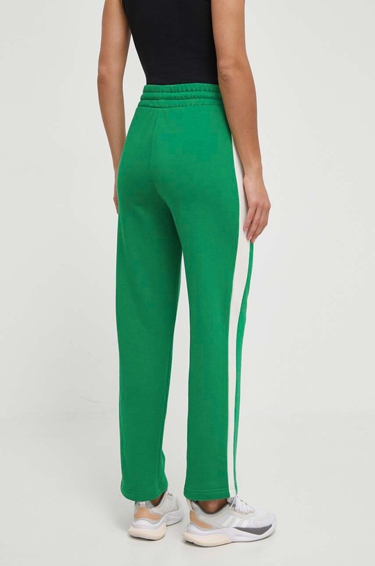 Odzież Puma spodnie dresowe ICONIC T7 625411 zielony