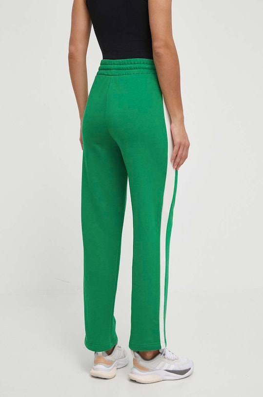 Odzież Puma spodnie dresowe ICONIC T7 625411 zielony