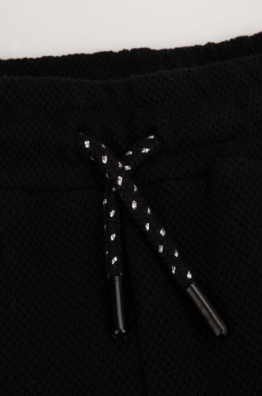 Dziewczynka Coccodrillo spodnie dresowe bawełniane dziecięce WC4120101OWJ czarny