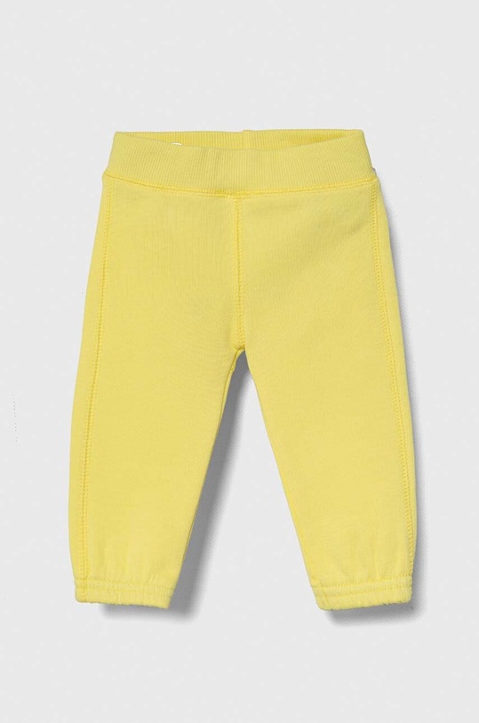 United Colors of Benetton spodnie dresowe bawełniane niemowlęce 3J70AF01L.W.Seasonal żółty SS24