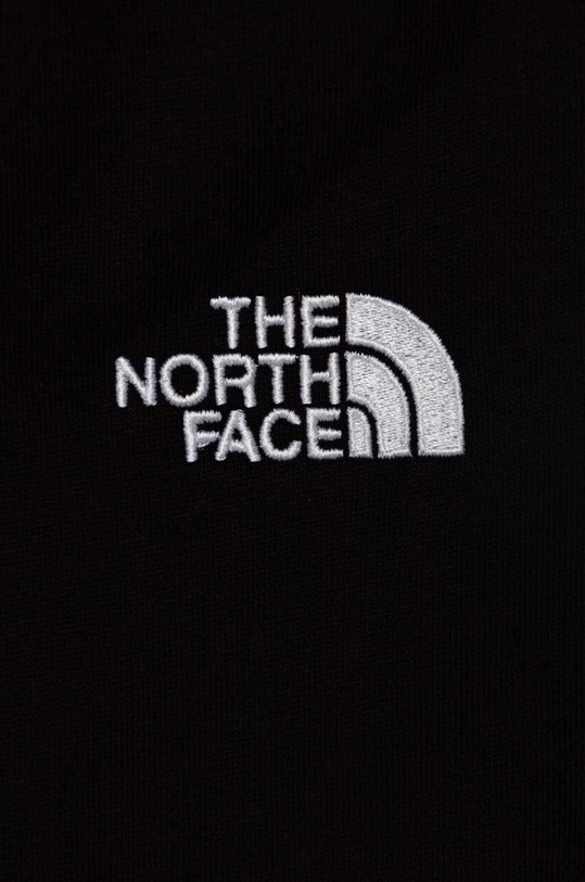 Chłopiec The North Face spodnie dresowe bawełniane dziecięce OVERSIZED JOGGERS NF0A89PE czarny