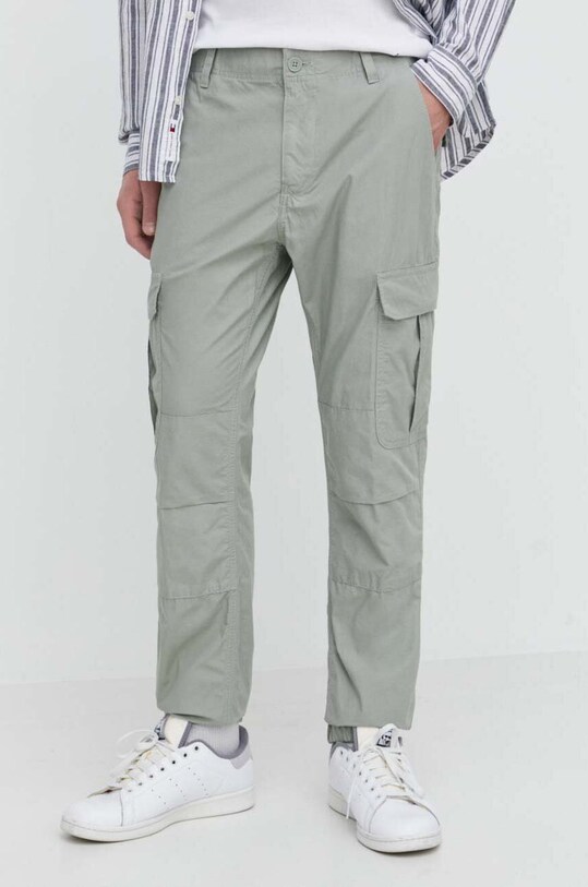 Hlače Tommy Jeans bez uzorka zelena DM0DM18342