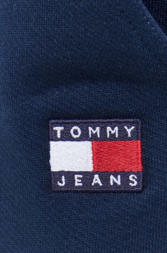 Bavlnené tepláky Tommy Jeans tmavomodrá DM0DM18355