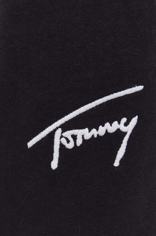 Bavlněné tepláky Tommy Jeans černá DM0DM18356