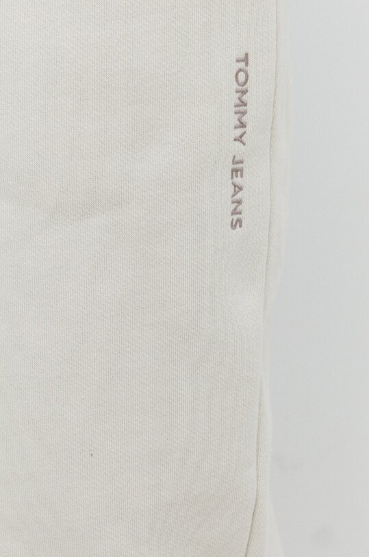 Pamučni donji dio trenirke Tommy Jeans bež DM0DM18378